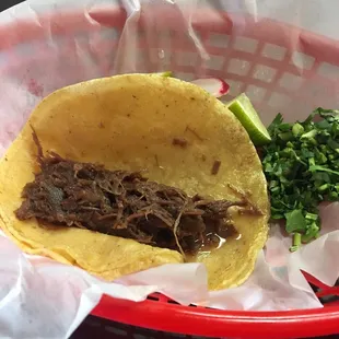Barbacoa taco with corn tortilla