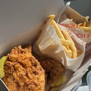 a box of fried chicken and french fries