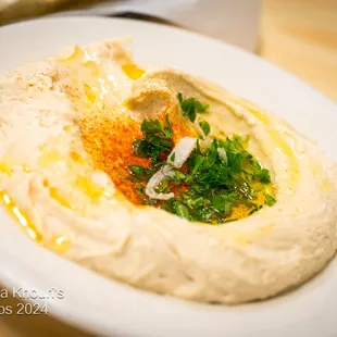 Hummus
 A Thick Creamy Garbanzo Bean Dip Made with, Tahini, Lemon Juice, and Garlic. VGN