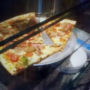 two slices of pizza on a plate