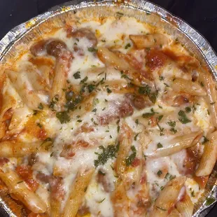 Penne pasta red meat sauce and crushed chicken!! Delicious