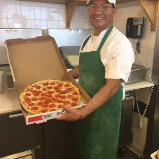 The best pizza in the town this very handsome guy make my pizza today and it was very delicious  Best pizza ever