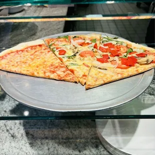 Pizza slices on display @ Mamma Lucia
