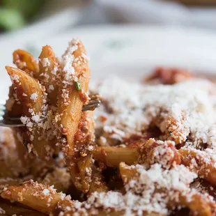 a plate of pasta with parmesan cheese