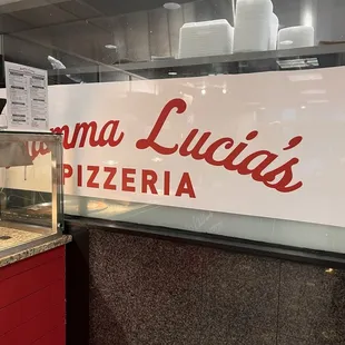 a pizza in a glass case