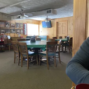 a woman sitting at a table in a restaurant