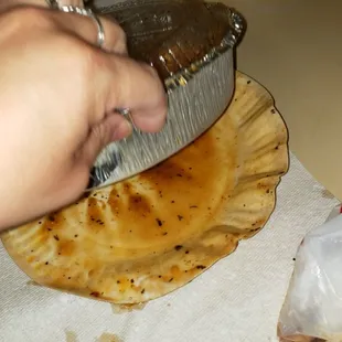 Marsala sauce spilled all over the place.  Who would have thought a paper plate would contain spillage.  Idiots!!