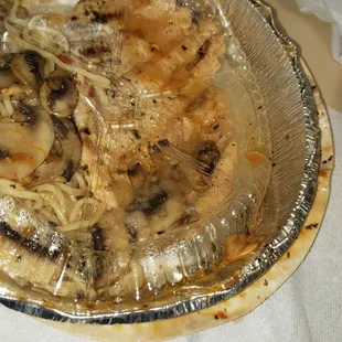 Very dry chicken marsala with collapsed container