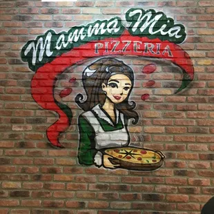 a woman holding a pizza