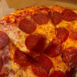 a slice of pepperoni pizza