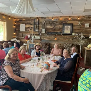 a group of people sitting around a table