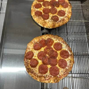 Two pepperoni pizzas to go!