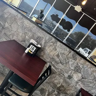 Tables and booths inside for dine in.