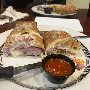a plate with a sandwich cut in half