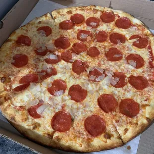 Thin crust pepperoni and onion pizza