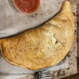 Philly chicken calzone (huge! Fork for perspective)