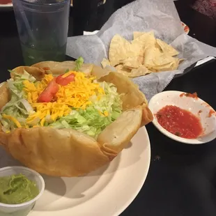 a taco salad and chips