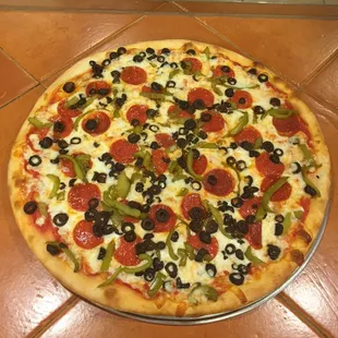 a pizza with pepperoni and olives