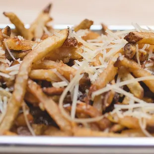 Did you know you can upgrade your side of fries to Garlic Fries?  Fresh, hand cut, and seasoned with Mammoth seasoning, garlic, and parm.