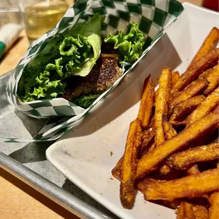 Burger wrapped in lettuce w/sweet potato fries