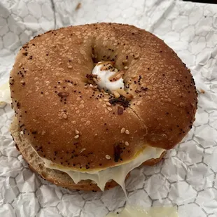 a bagel sandwich on a piece of paper