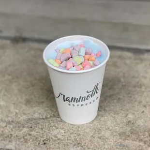 a paper cup filled with marshmallows