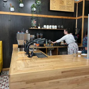 Coffee robot makes good pour over, but the lovely baristas make it happen.