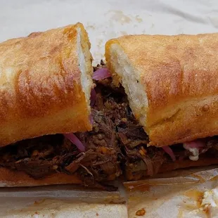 Taurus (braised brisket), ordered without cheese or arugula, add pickled red onions.