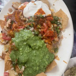 Asada nachos with guacamole and sour cream