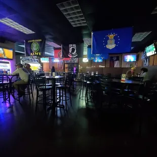 a bar with tables and chairs