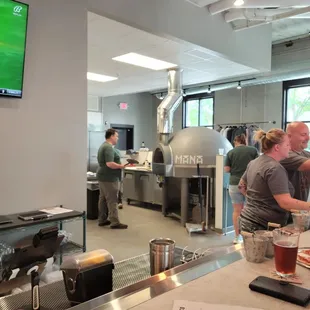 a group of people working in a brewery