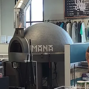 piizza oven &amp; merch behind