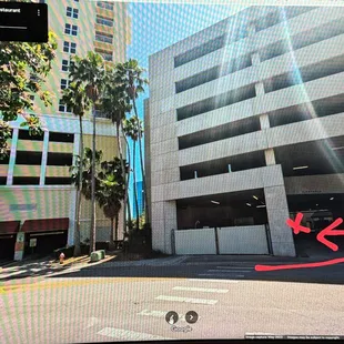 Laura Street Parking Garage entrance, very easy, rear door, 20 steps inside! Look at the TWO RED awnings!