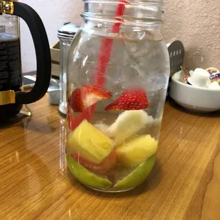 a mason jar filled with fruit