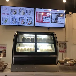 a display of sandwiches and drinks