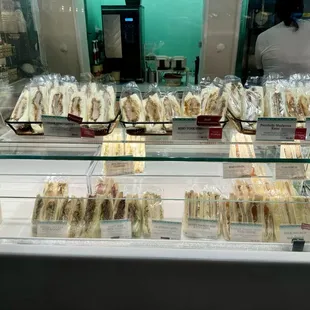 a display of sandwiches in a glass case