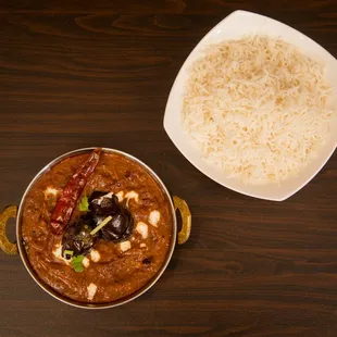 a bowl of rice and a bowl of curry