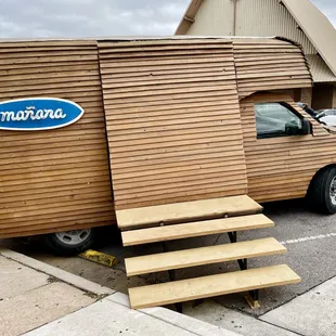 Can&apos;t miss the all-wood paneled Mañana van parked on SoCo.