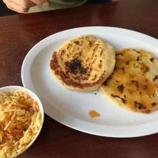 Pork and cheese Pupusas and a plain cheese Pupusas