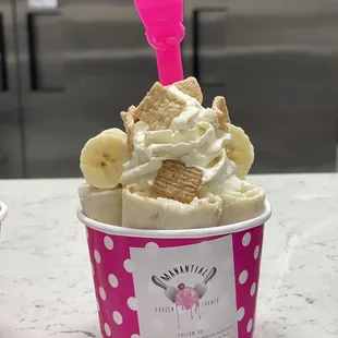 a cup of ice cream with bananas