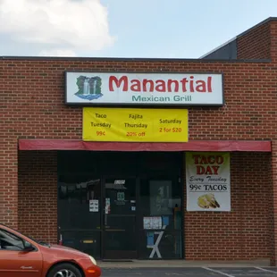 a car parked in front of the restaurant