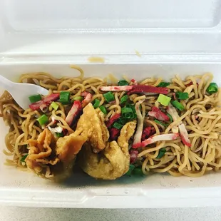 a take out container with noodles and chicken