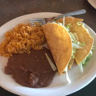 Awesome tacos, good rice, pass on the beans.