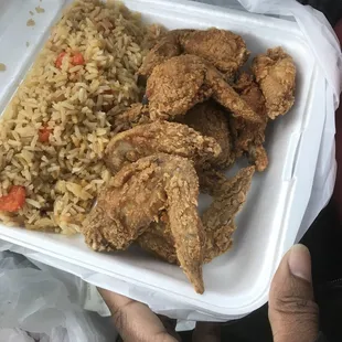 a tray of fried chicken and rice