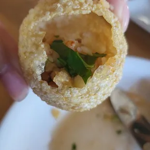 Pani puri (Crack and then add the tamarind water and Potatoes)