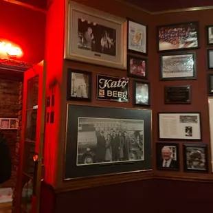 a wall full of framed photos