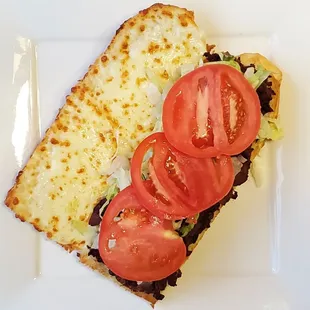 a sandwich with tomatoes and cheese