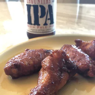 Wings w/ spicy barbecue...wash it w/ a cold IPA.