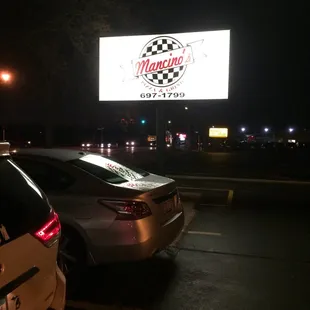 two cars parked in a parking lot