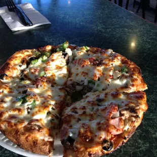 8&quot; Mancino&apos;s Pride pizza, which is rather deep even though the crust is generally thin.